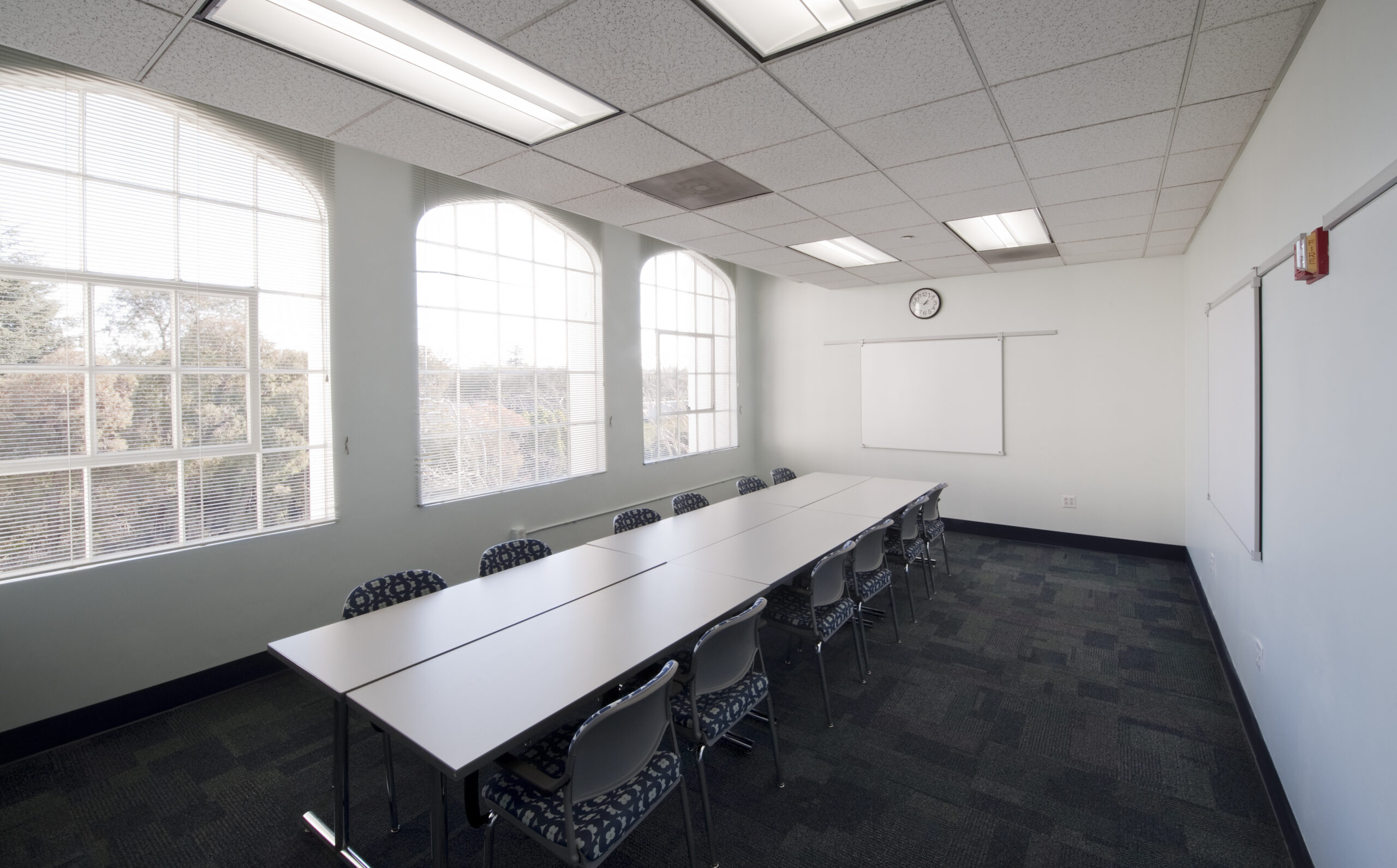 TEC Pleasanton room set up in a conference style layout for 12 people. 